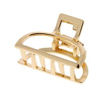 Petite pince croco m&eacute;tallique demi lune dor&eacute;e